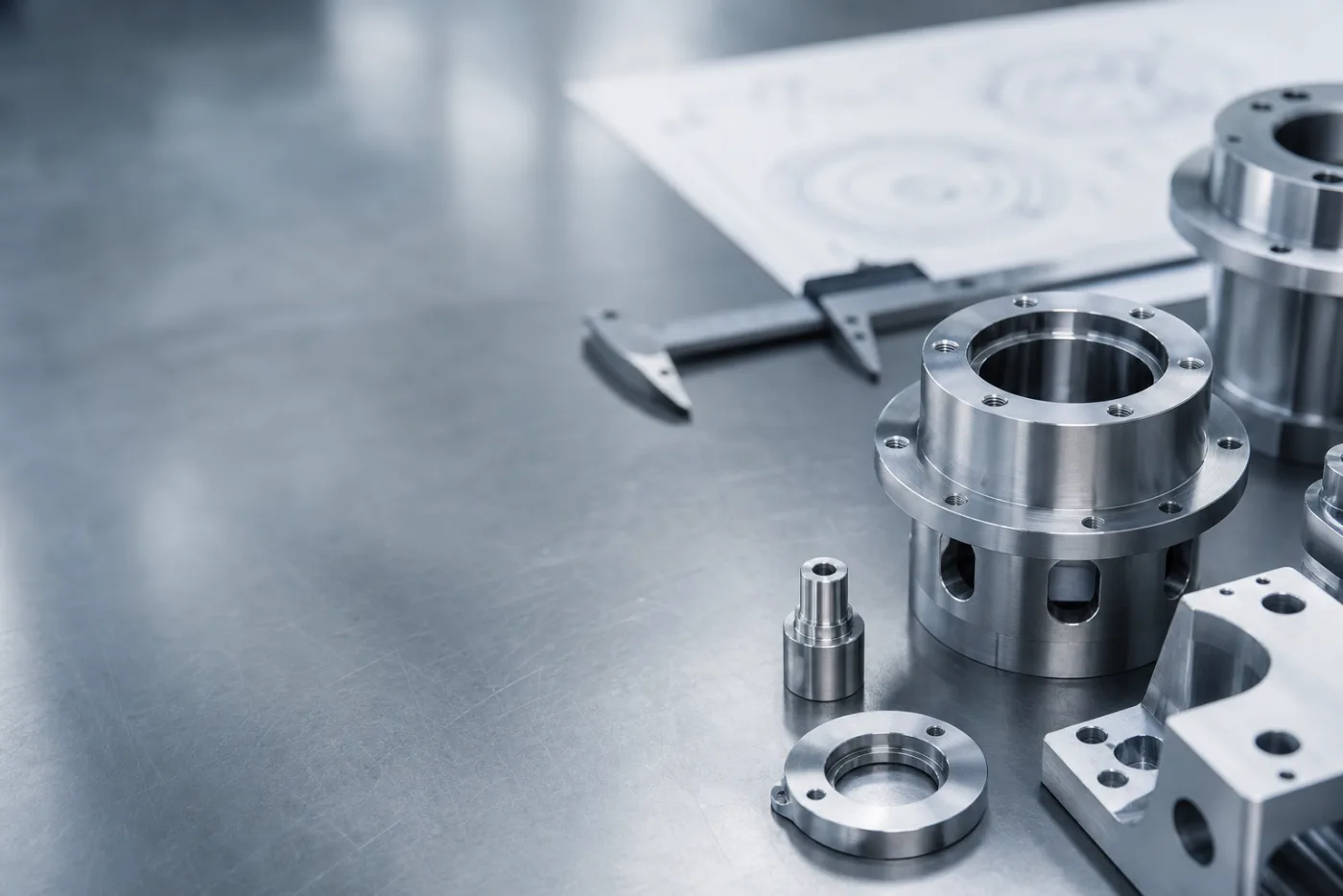 Precision machined metal parts on inspection table